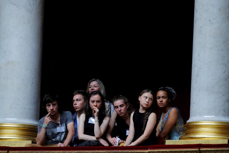 
                    Swedish environmental activist Greta Thunberg and Ivy-Fleur Boileau, Virgile Mouquet, Adelaide Charlier and Alicia Arquetoux, from the Youth for Climate movement, attend the questions to the government session at the National Assembly in Paris, in July. Ms Thunberg later became Time magazine's youngest Person of the Year.
                